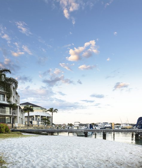 Pier 21 hotel apartments with a beach in front Image