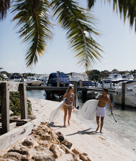 Couple paddleboarding at Pier 21 beach Image