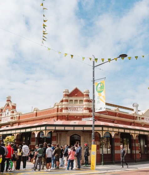 People gathered near the entrance to the Fremantle markets Image